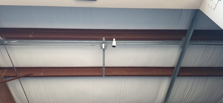 Customer-supplied surviellance camera mounted in bay